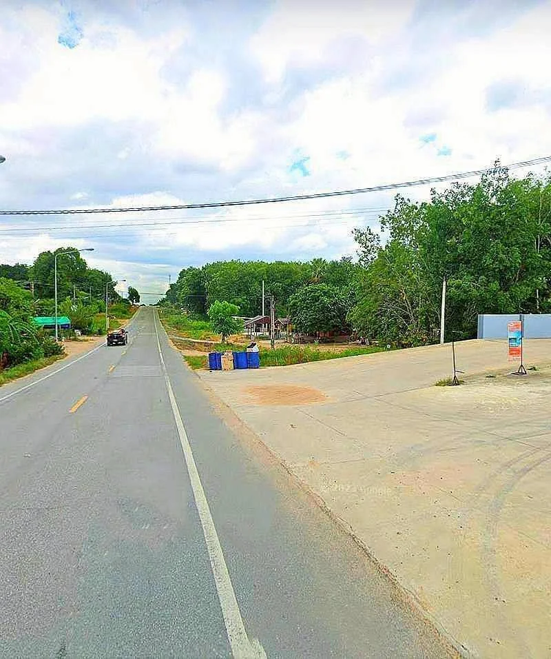 next to the asphalt road